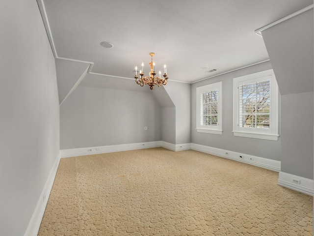 bonus room with visible vents, baseboards, and a notable chandelier