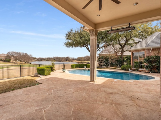 view of swimming pool featuring a fenced in pool, fence private yard, a ceiling fan, and a patio area