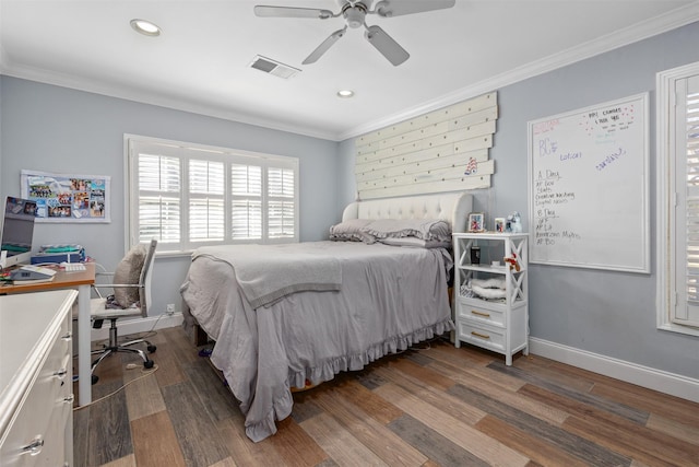 bedroom featuring ornamental molding, dark wood finished floors, visible vents, and baseboards