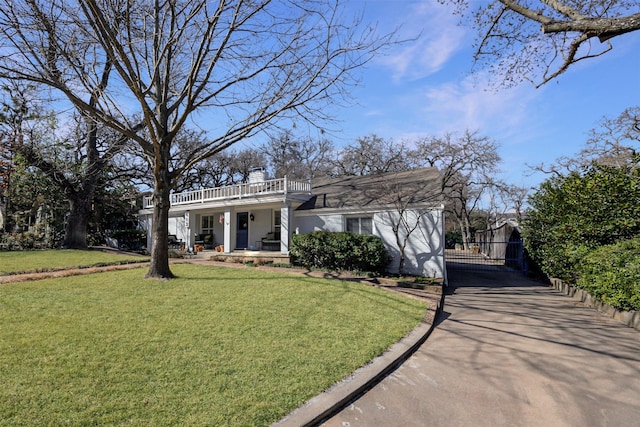 view of front of property with a front lawn and a chimney