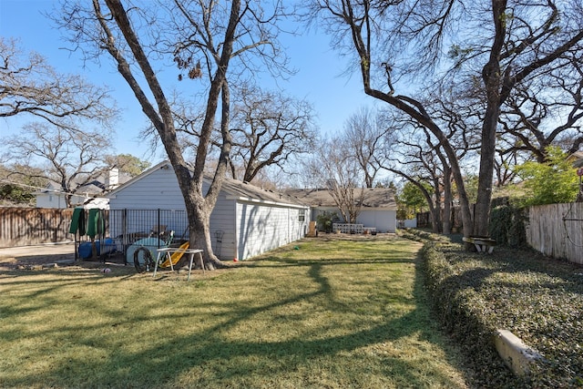 view of yard with a fenced backyard