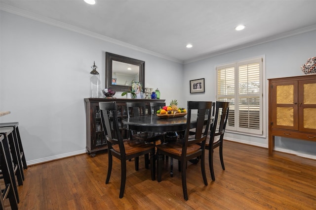 dining space with ornamental molding, dark wood-style flooring, recessed lighting, and baseboards