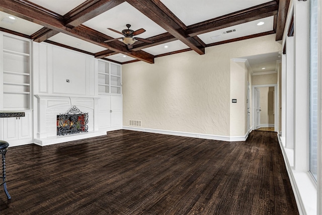 unfurnished living room featuring built in features, beam ceiling, a large fireplace, coffered ceiling, and baseboards