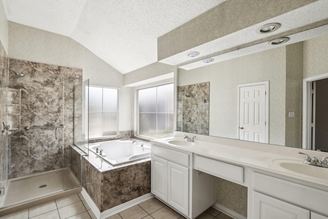 bathroom with lofted ceiling, a textured ceiling, a sink, a shower stall, and a bath