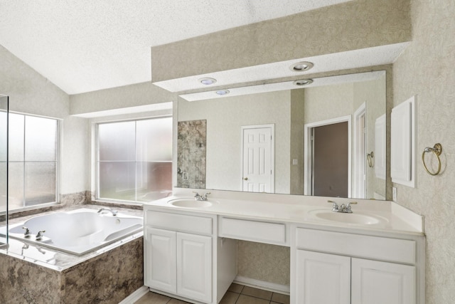 full bathroom featuring lofted ceiling, a garden tub, a sink, and double vanity