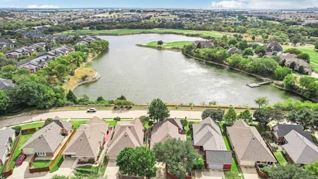 bird's eye view featuring a water view and a residential view