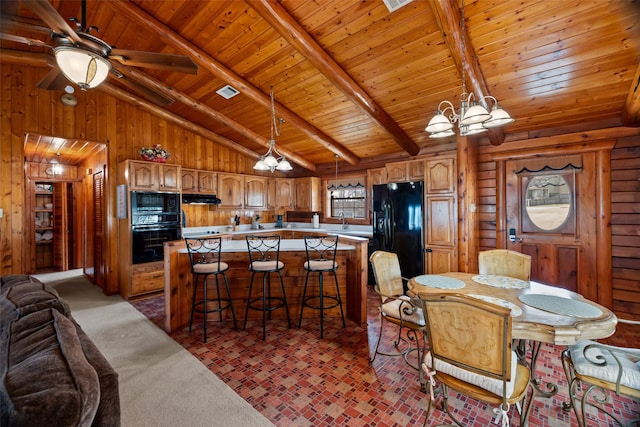 kitchen featuring wood walls, wood ceiling, lofted ceiling with beams, and black appliances