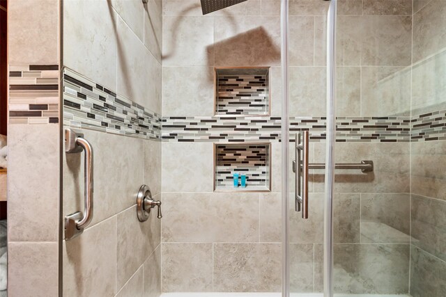 bathroom with a shower stall