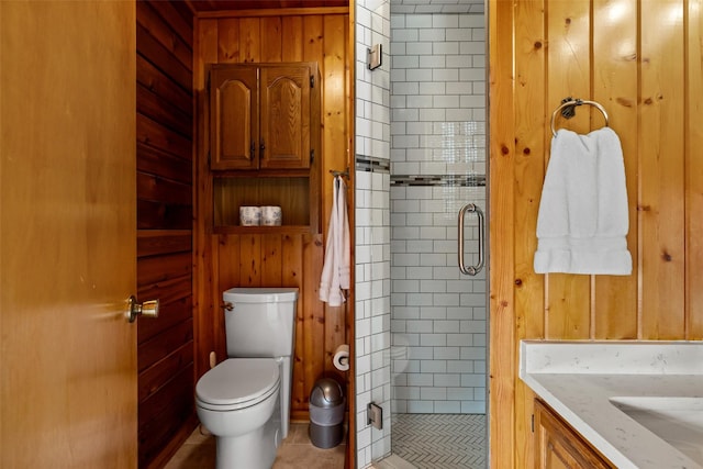 full bathroom featuring wood walls and a shower stall