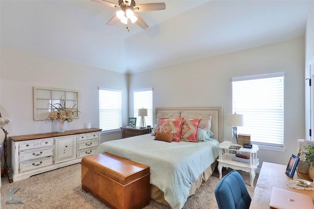 bedroom with light carpet and a ceiling fan