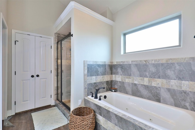 full bathroom with a stall shower and a tub with jets