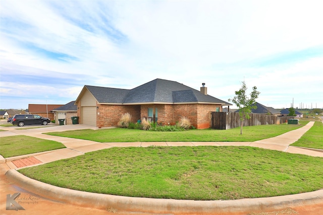 view of home's exterior with a garage, concrete driveway, brick siding, and fence