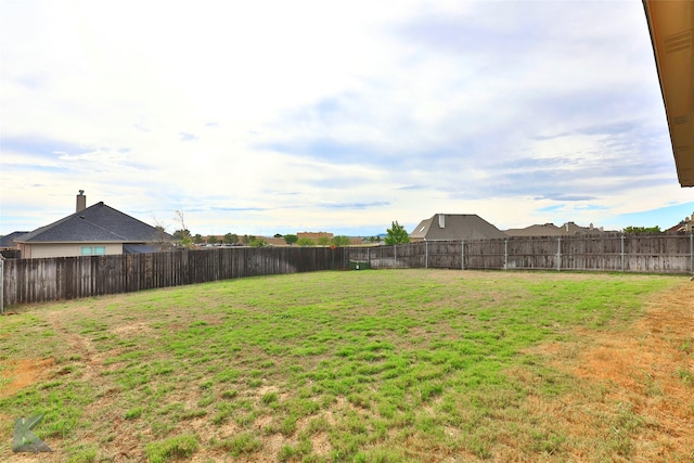 view of yard with a fenced backyard