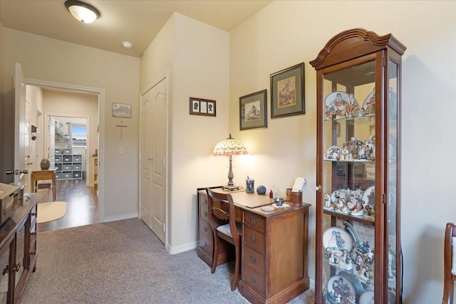 carpeted office with baseboards