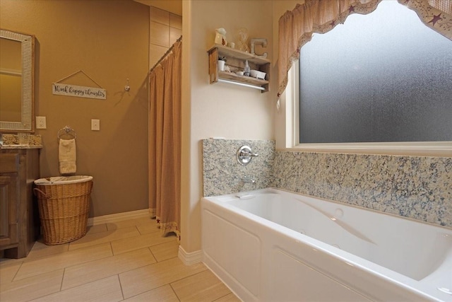 full bathroom featuring a bath and vanity