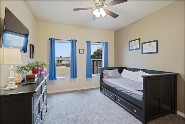 interior space with carpet flooring, ceiling fan, and baseboards