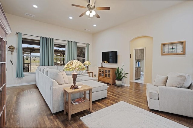 living room featuring visible vents, dark wood-style flooring, and recessed lighting