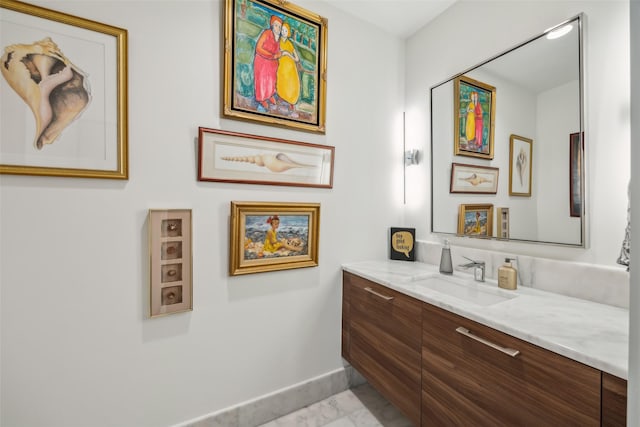 bathroom featuring vanity and baseboards