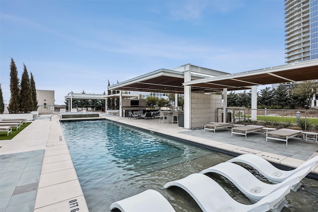 community pool with a patio and fence