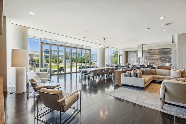 living area with wood tiled floor and floor to ceiling windows