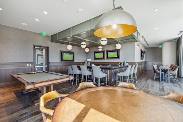 recreation room with a community bar, a wainscoted wall, billiards, and wood finished floors