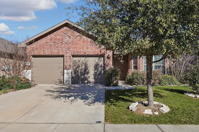 view of front facade with driveway, brick siding, a front lawn, and an attached garage