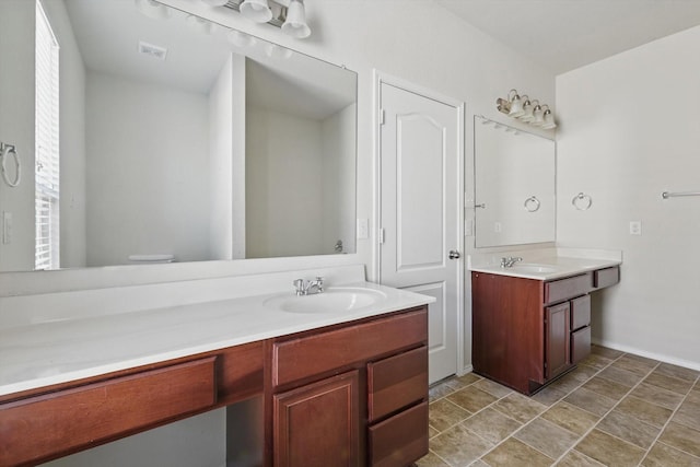 full bathroom featuring visible vents and vanity