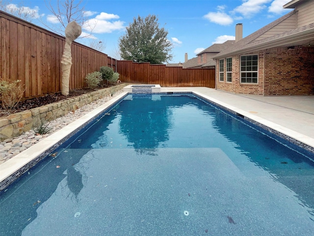 view of swimming pool with a patio area, a fenced backyard, and a fenced in pool