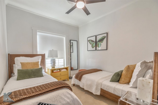 carpeted bedroom with ceiling fan and crown molding