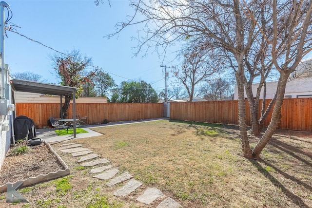 view of yard with a fenced backyard and a patio