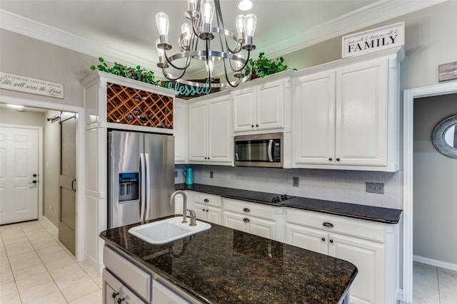 kitchen featuring stainless steel appliances, crown molding, a sink, and decorative backsplash