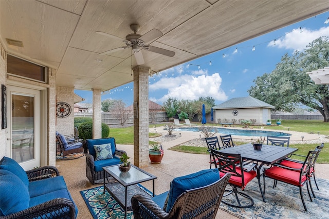 view of patio / terrace with visible vents, a fenced in pool, ceiling fan, a fenced backyard, and outdoor dining area