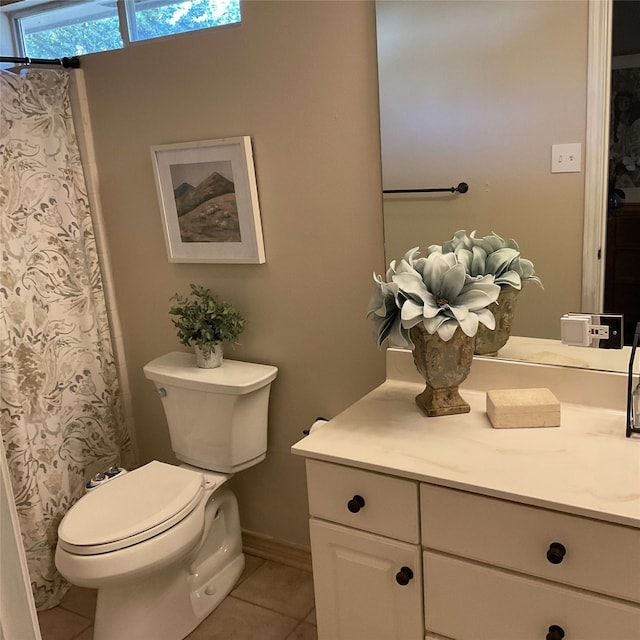 full bathroom with vanity, curtained shower, tile patterned flooring, and toilet