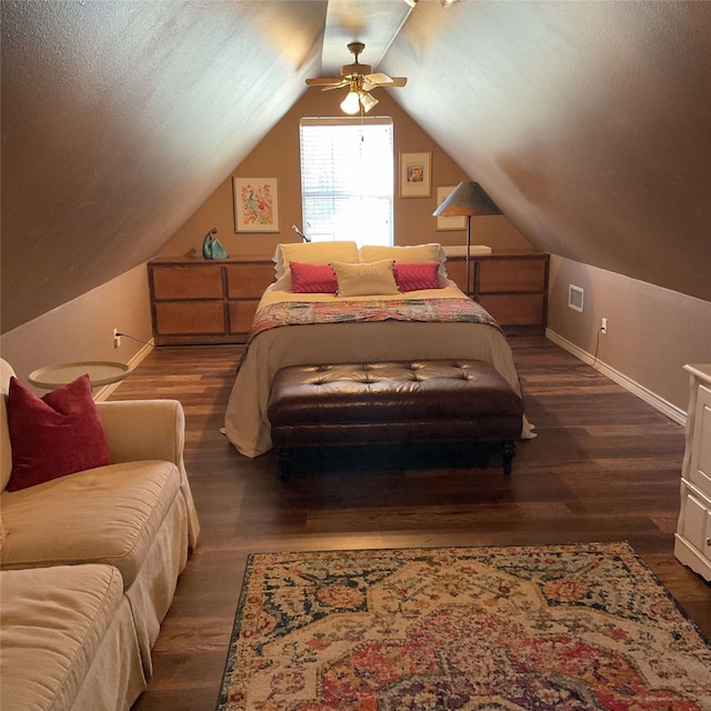 bedroom featuring a textured ceiling, lofted ceiling, a ceiling fan, baseboards, and dark wood-style floors