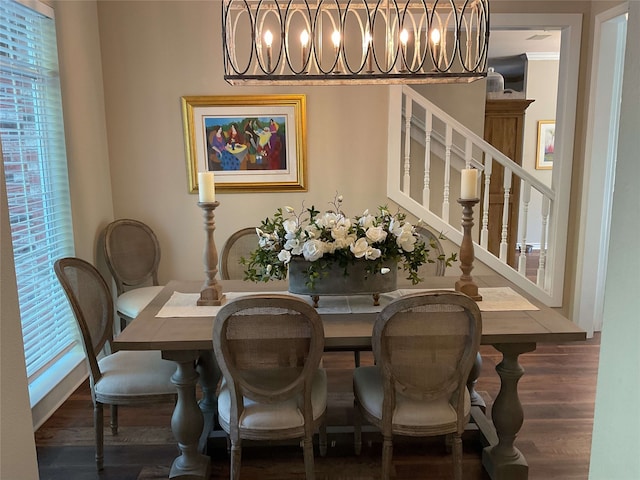 dining room featuring stairs and wood finished floors