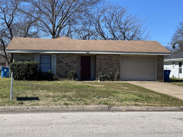 ranch-style home with an attached garage, brick siding, a shingled roof, concrete driveway, and a front lawn