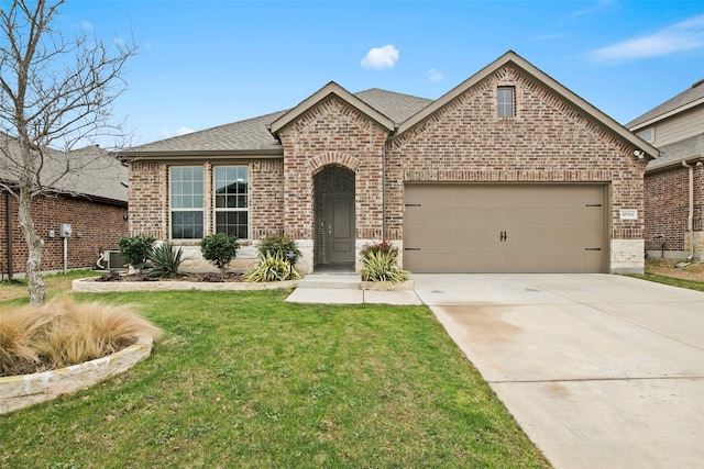 view of front facade with brick siding, roof with shingles, concrete driveway, a front yard, and a garage