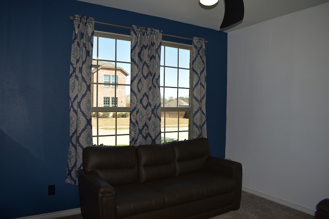 sitting room with carpet and baseboards