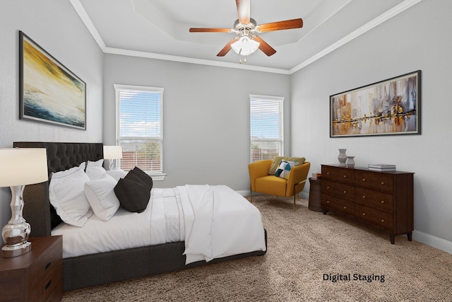 bedroom with a ceiling fan, carpet, baseboards, a tray ceiling, and crown molding