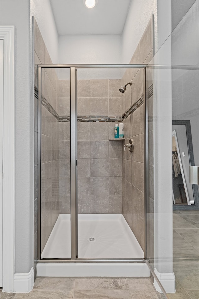 full bath with a shower stall