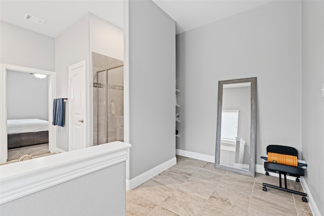 full bath featuring ensuite bath, baseboards, visible vents, and a tile shower