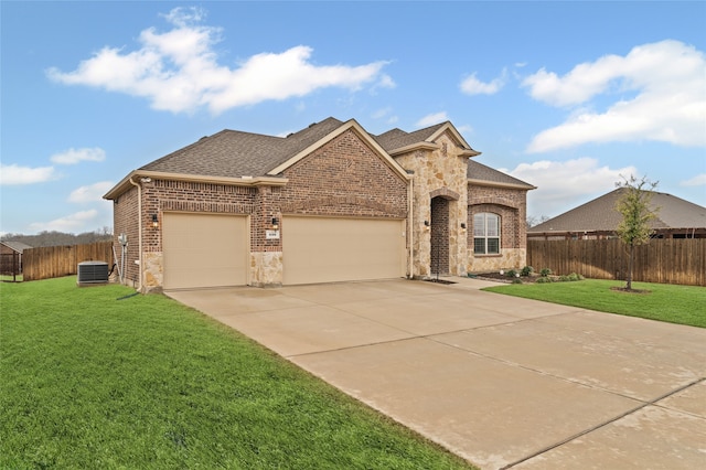 french country inspired facade featuring brick siding, a shingled roof, a front yard, a garage, and driveway