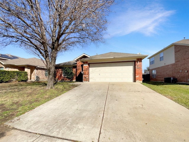 ranch-style home featuring an attached garage, driveway, a front yard, and brick siding