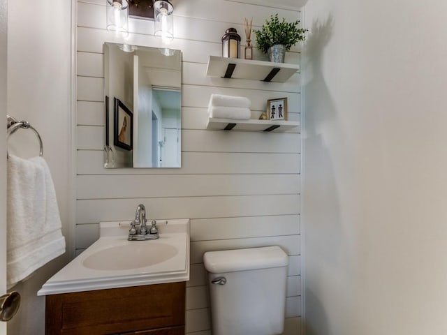 bathroom featuring toilet and vanity