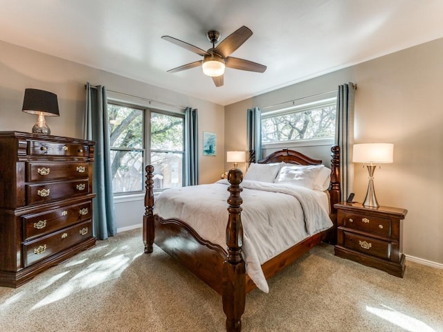 bedroom with baseboards and a ceiling fan