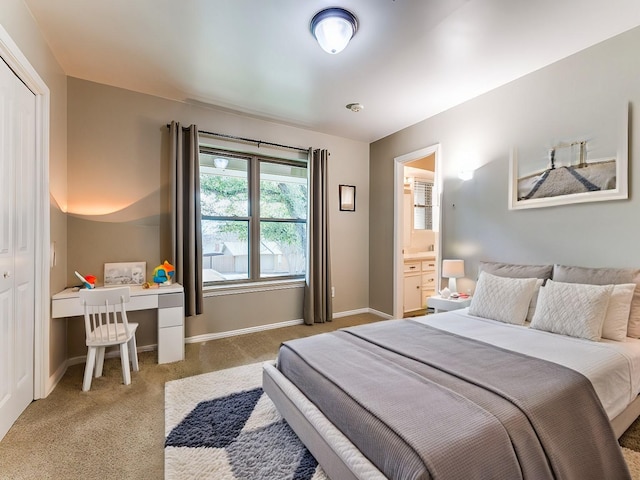 bedroom with carpet flooring and baseboards