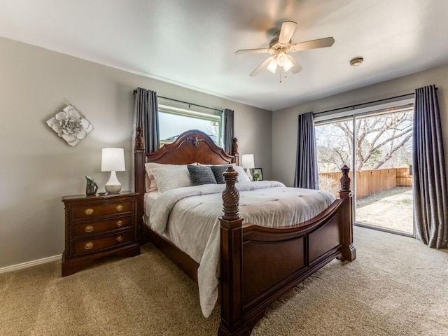 bedroom featuring access to outside, a ceiling fan, baseboards, and carpet floors