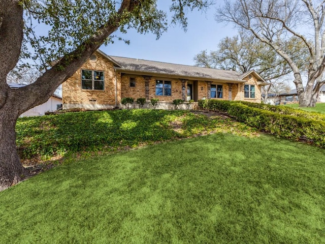 single story home with brick siding and a front lawn