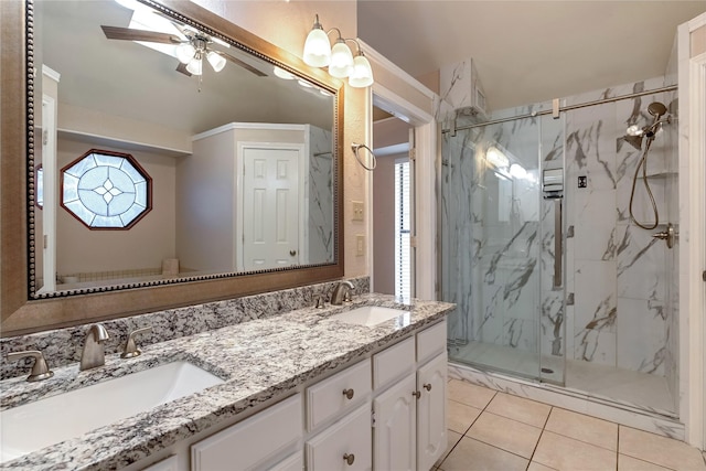 bathroom featuring double vanity, a marble finish shower, and a sink