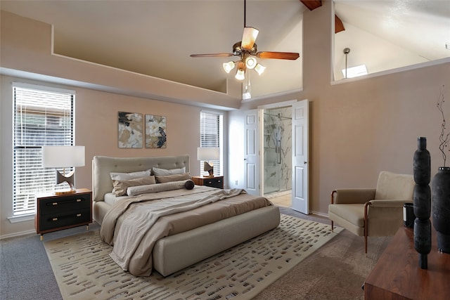 bedroom featuring light carpet, high vaulted ceiling, ensuite bathroom, and baseboards